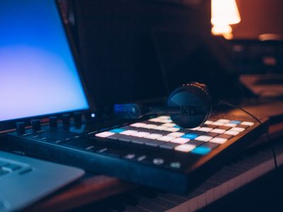 Close up on music production controller and headphones